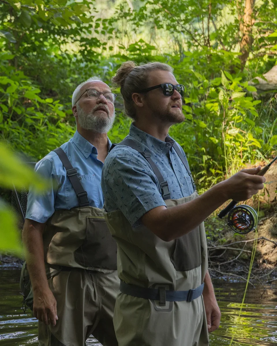 Two men fly fishing