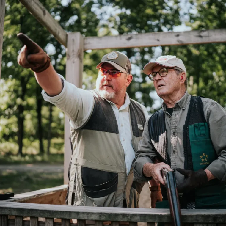 Two men clay shooting