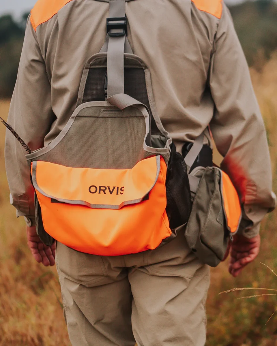 Hunter walking through field