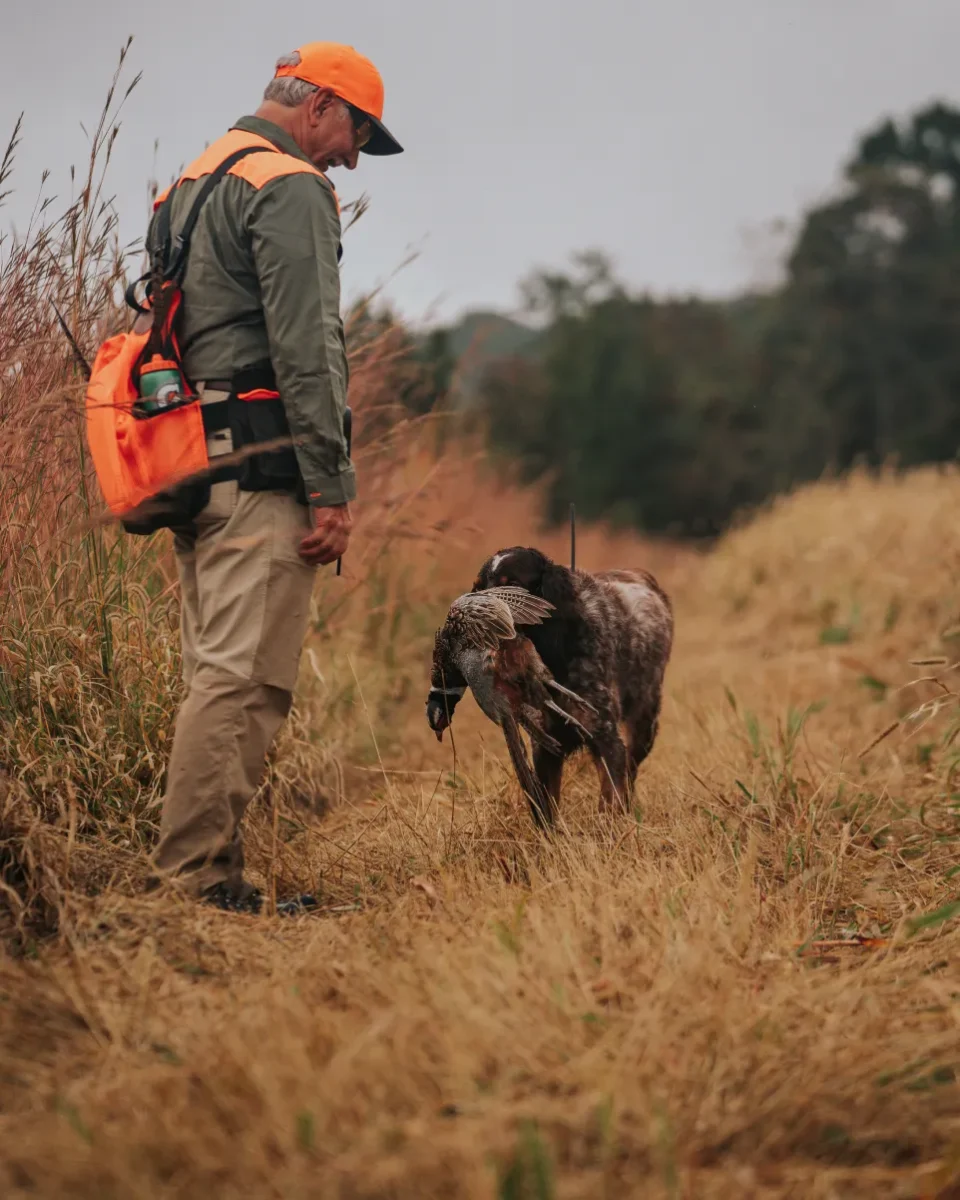 Man with hunting dog
